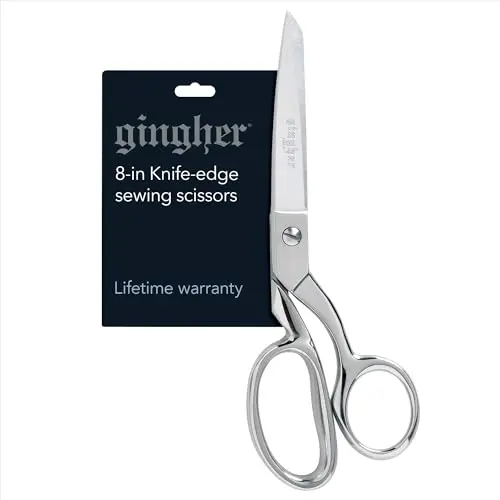 Gingher dressmaker's fabric scissors cutting through multiple layers of fabric