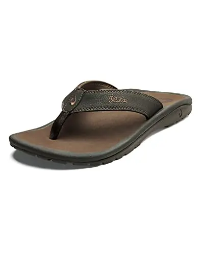 OLUKAI Ohana men's flip flops on beach with water-resistant design