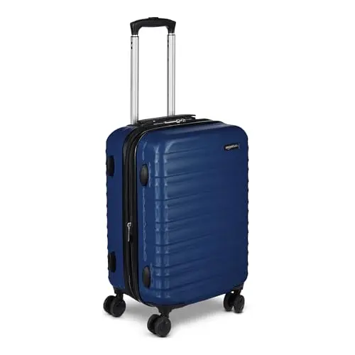 Amazon Basics Hardside Carry On luggage in navy blue with spinner wheels