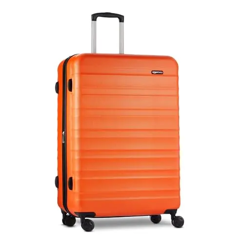 AMAZON BASICS orange hardside suitcase with four spinner wheels