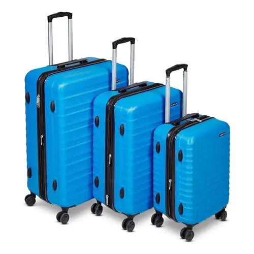 Amazon Basics 3-piece hardshell luggage set in light blue with multi-directional wheels