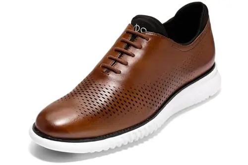 Cole Haan Zerogrand wingtip dress shoes in British tan with black and ivory accents