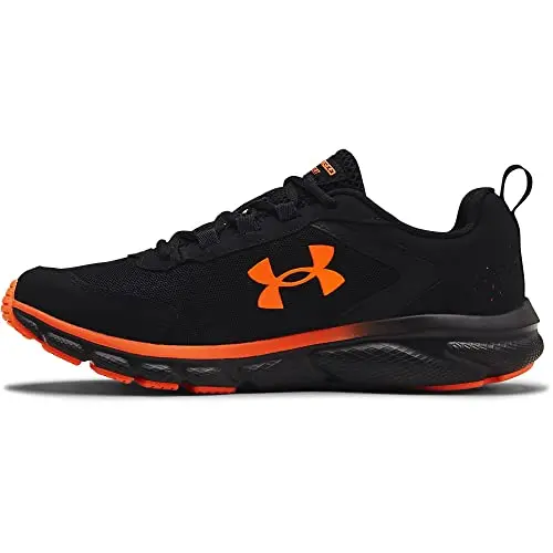 Under Armour Charged Assert 9 running shoes in black with orange accents