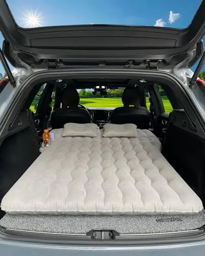 Canodoky SUV air mattress inflated in car with cup and phone holders