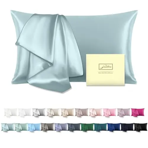 Suatien haze blue silk pillowcase on a pillow