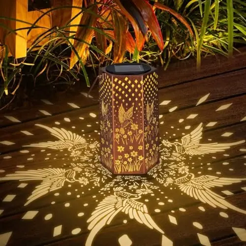 Eandisom hummingbird solar lantern glowing in garden at dusk