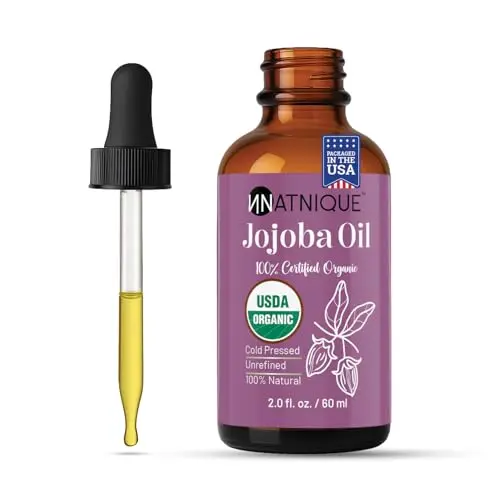 Natnique Organic Jojoba Oil in amber glass bottle
