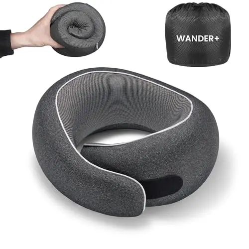 WANDER PLUS black travel neck pillow showing velcro adjustment